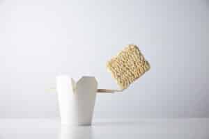 brick dry noodles balances edge chopsticks blank takeaway box isolated white commercial retail set